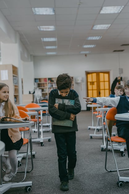 A Boy Getting Bullied by Classmates Inside the Classroom